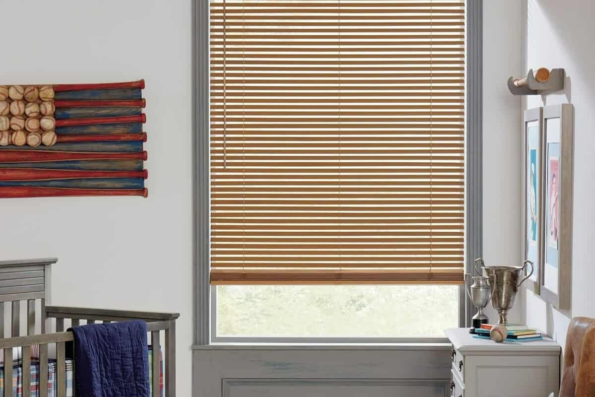 Hunter Douglas Parkland® Wood Blinds faux wood blinds installed on a window in a home