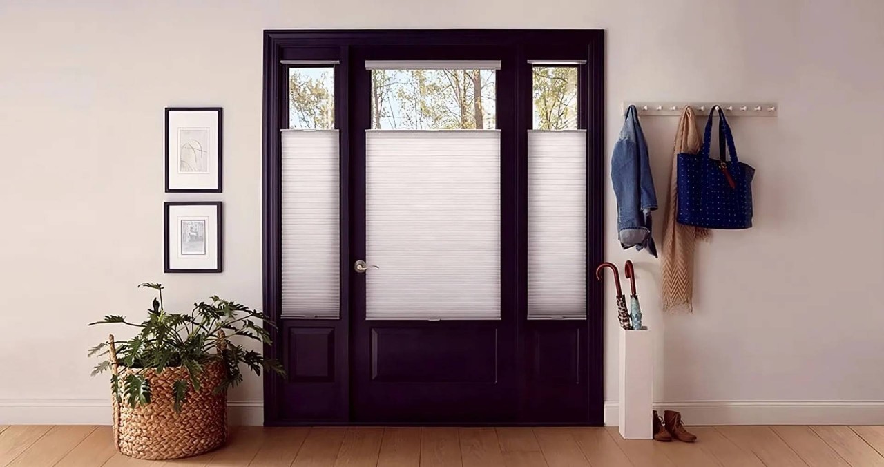 Dark wood front door with white Hunter Douglas shades decorating sidelights near Concord, CA